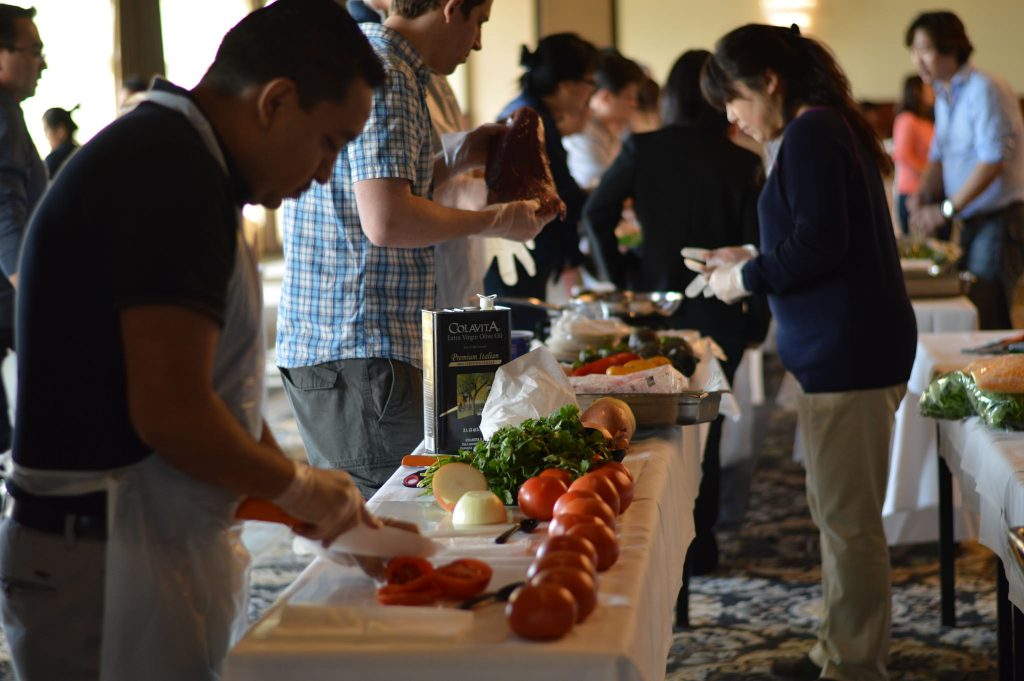 Facilitators and teams enjoying the food truck challenge