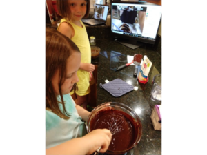 Kids preparing chocolate truffles